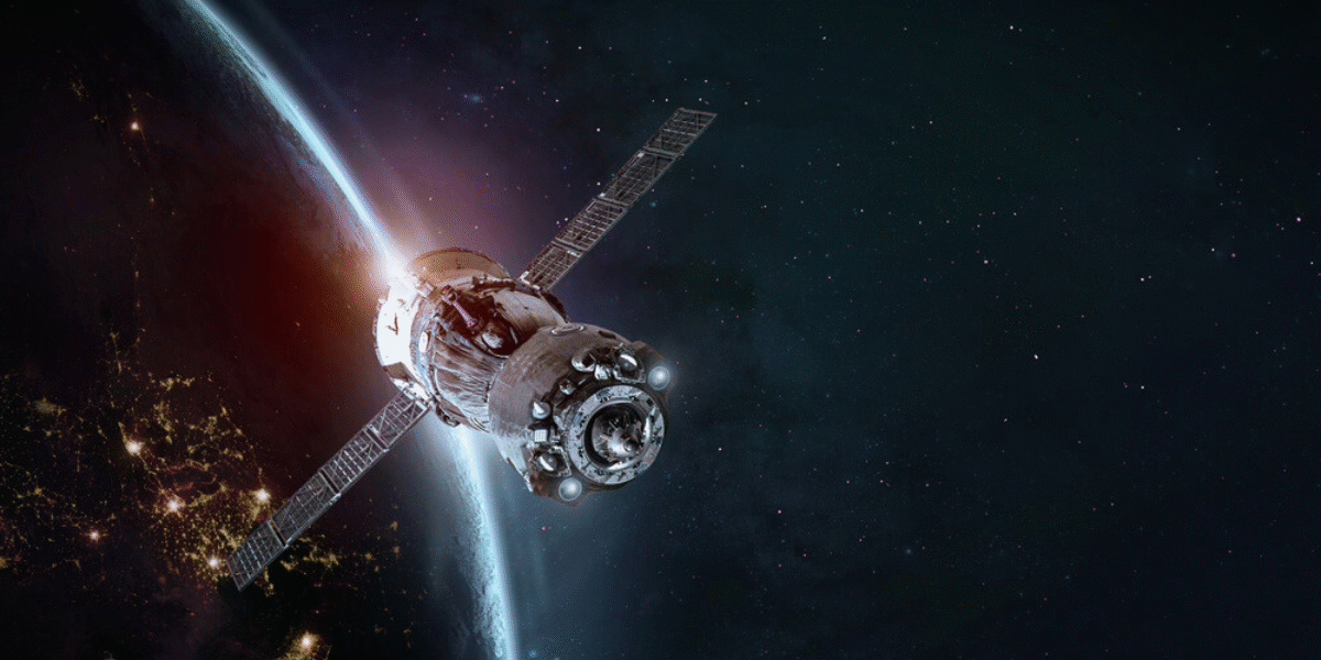 Artificial satellite orbiting Earth with visible solar panels and atmospheric glow in the background, representing advanced space technology.