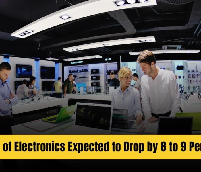 Customers browsing electronic gadgets in a retail store as GST rates cut is expected to reduce prices of TVs, ACs, and other appliances.