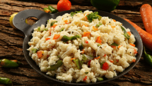 Bowl of vegetable upma packed with fibre and protein for improved digestion and gut health as suggested by AIIMS gastroenterologist.