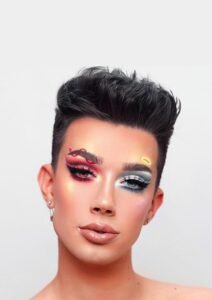 Split-face halloween makeup design showing angel and devil contrast with red and white tones.