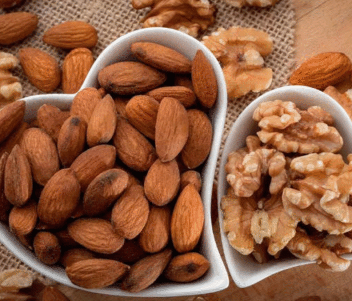 cup of dry fruits, almonds and walnuts
