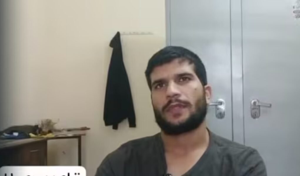 Close-up video still of **Umar un Nabi**, the alleged Delhi bomber, speaking in a room with a metal cupboard and a hanging jacket, discussing his extreme views on suicide bombings.