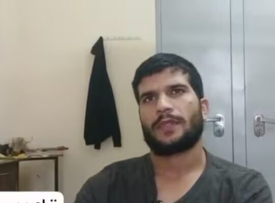 Close-up video still of **Umar un Nabi**, the alleged Delhi bomber, speaking in a room with a metal cupboard and a hanging jacket, discussing his extreme views on suicide bombings.