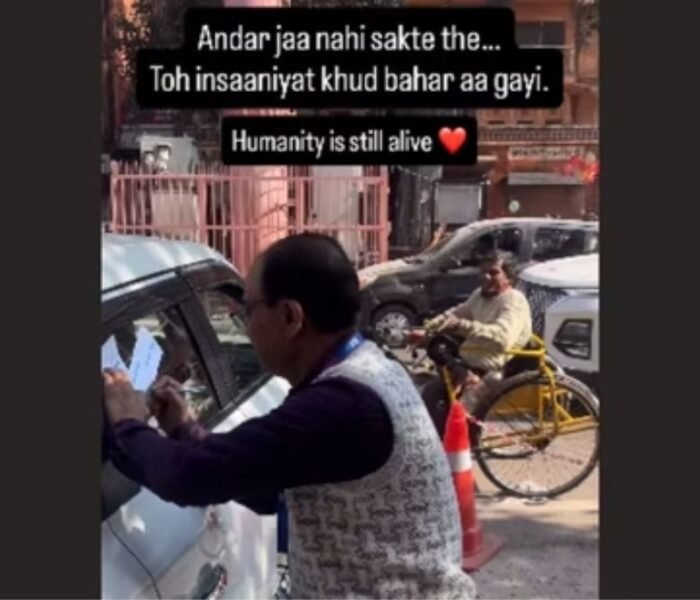 SBI employee helping disabled man complete bank formalities outside branch